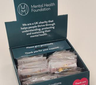Photo of our enamel green ribbon badge boxes