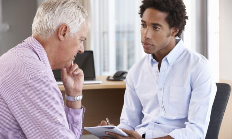 Someone speaking to a professional for help
