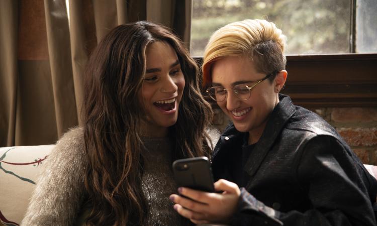 Two young people laughing