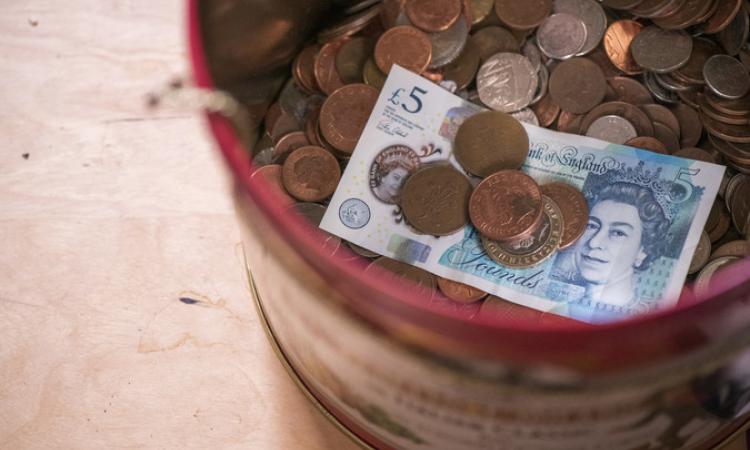 Tin of coins and notes of GBP
