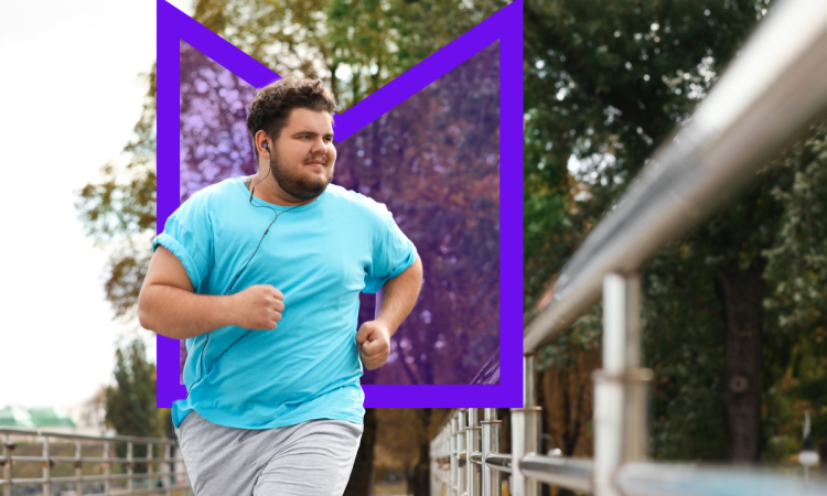 A young man running across a bridge while he listens to music 